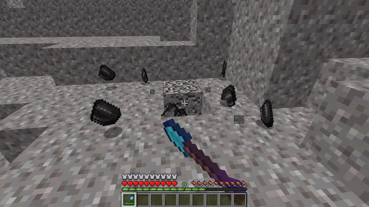 Använda en spade förtrollad med förmögenhet för att få mer flint i Minecraft.